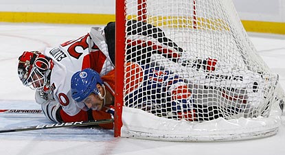 Either it's a really cold night in Ottawa, or Edmonton's Jordan Eberle is an unwelcome guest in Brian Elliott's net.  (Getty Images)