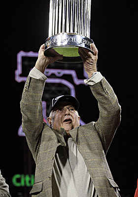 In 2008, as general manager of the Phillies, Pat Gillick hoists the World Series trophy after Philly beat Tampa Bay in five. (AP)