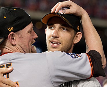 Pitcher Madison Bumgarner (right) played a key role in helping the Giants win the World Series. (Getty Images)