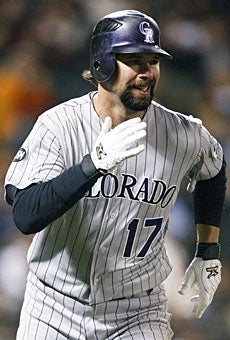 Todd Helton's batting average often is a sign of the club's success. (US Presswire)