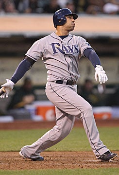 If Carlos Pena is going to win over Cubs fans, he'll have to improve from last season's .196 average. (Getty Images)