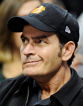Charlie Sheen couldn't be any more of a train wreck than Frank McCourt. (Getty Images)