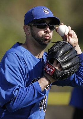The Mets will absorb the $12 million remaining on Oliver Perez's $36 million, three-year contract. (AP)
