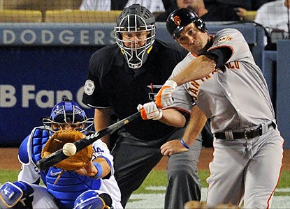 Pat Burrell hits a solo home run -- the Giants' only run -- during the ninth inning. (AP)