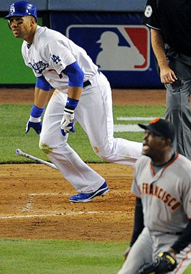 Giants pitcher Santiago Casilla watches James Loney's RBI double in the eighth inning. (AP)