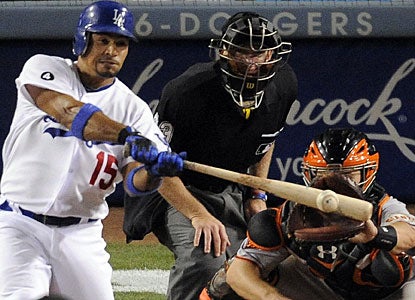 Rafael Furcal connects with the single that drives in three runs for Dodgers in the sixth inning. (AP)