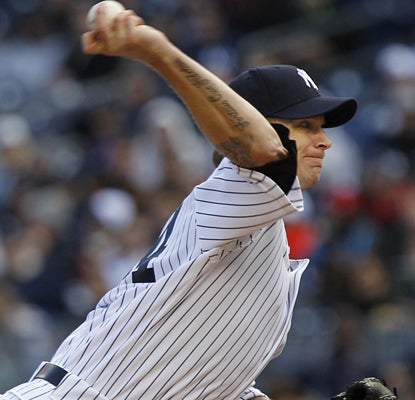 A.J. Burnett is solid in his first outing for the Yankees this season, pitching five innings and allowing three runs. (AP)