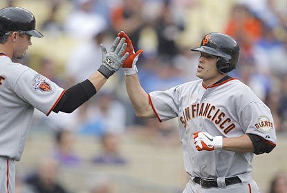 Freddy Sanchez lends a hand in the Giants' rout over the Dodgers by clubbing his first home run of the season.  (AP)
