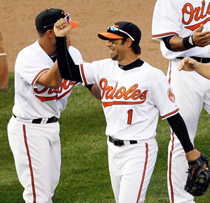 Second baseman Brian Roberts drives in three runs while helping the Orioles win their home opener. (Getty Images)