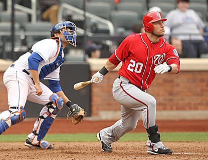 Laynce Nix watches the flight of his home run in the 11th inning, which secures the victory for Washington.  (Getty Images)