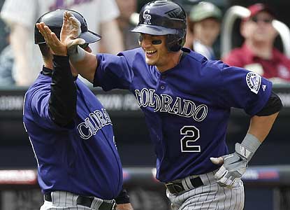 Troy Tulowitzki has three hits in Game 1, including a seventh-inning HR that gives him an 8-for-12 effort in this series. (AP)