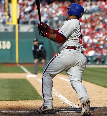 Philadelphia's Carlos Ruiz hits the go-ahead sacrifice fly in the eighth inning. (AP)