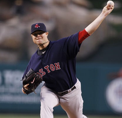 Jon Lester pitches six scoreless innings and his bullpen holds up to give him his second win as the Red Sox top the Angels. (AP)