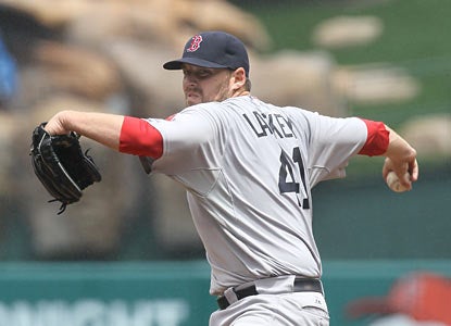John Lackey riddles his former team by striking out six batters throughout eight shutout innings. (Getty Images)