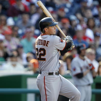Eli Whiteside follows through on a critical solo shot in the third inning -- helping San Francisco survive Washington.  (Getty Images)