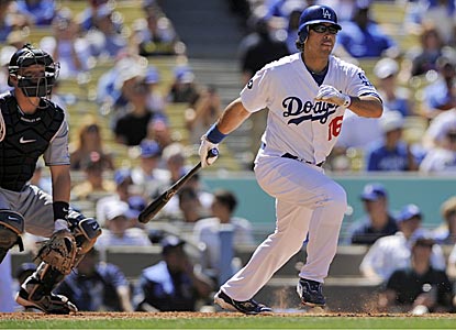 Andre Ethier hits a single up the first base line in the seventh inning to push his hitting streak to 27 games. (AP)
