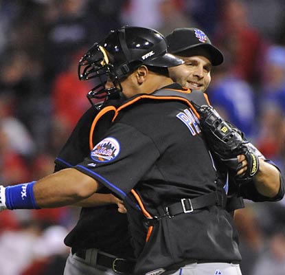 Ronny Paulino, who has five hits on the night, greets pitcher Taylor Buchholz, who earns the 'W' with a scoreless 14th inning.  (US Presswire)