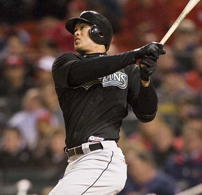 Mike Stanton watches his tie-breaking home run sail out to left-center field in the ninth inning.  (US Presswire)