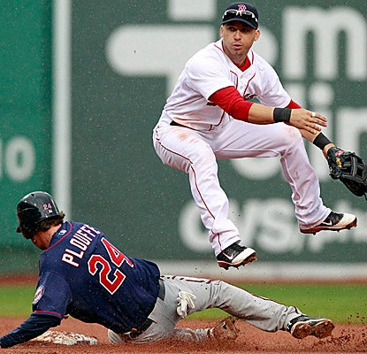 Trevor Plouffe is forced out at second as Boston's Marco Scutaro turns the double play in the sixth inning. (AP)