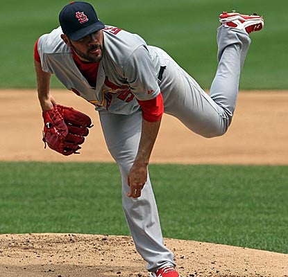 Jaime Garcia keeps the Cubs hitless until the sixth inning, when he gives up three straight singles. (Getty Images)