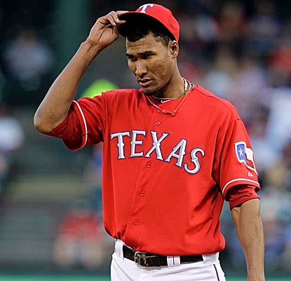 Rangers starter Alexi Ogando allows one run and five hits in just over six innings vs. the Angels. (AP)