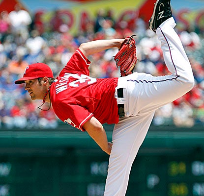 Coming off a dazzling performance in his previous start, C.J. Wilson gives up two earned in five innings. (AP)