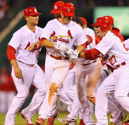 The Cardinals swarm Lance Berkman, who delivers a game-winning single for his 35th RBI of the season.  (Getty Images)