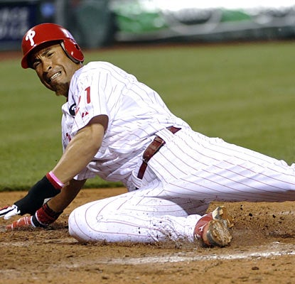 Wilson Valdez slides in for the winning run on a sacrifice fly from Jimmy Rollins in the eighth inning.  (US Presswire)