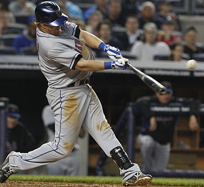 Justin Turner gets three hits, including this double, which gives him an RBI in six straight games. (AP)
