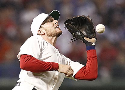 Jed Lowrie drops a pop fly in a tumultuous eighth inning in which the Cubs turn a 3-1 deficit into a 9-3 victory.  (US Presswire)