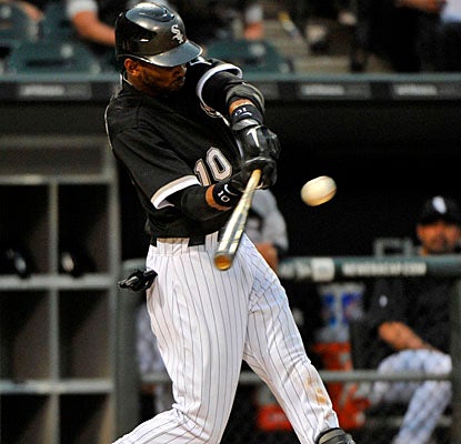 White Sox shortstop Alexei Ramirez swings for an RBI double in the eighth inning against the Dodgers. (US Presswire)