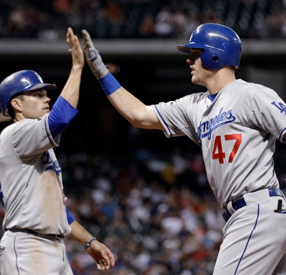 Jerry Sands celebrates his third-inning grand slam that helps power the Dodgers over the Astros. (AP)