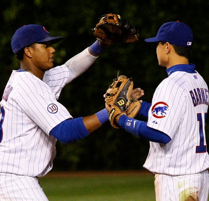 Cubs' shortstop Starlin Castro, left, and second baseman Darwin Barney celebrate their 11-1 win over the New York Mets (AP)