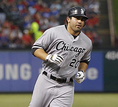 Carlos Quentin heads for the plate after his second home run -- a three-run shot that gives Chicago a 4-1 lead.  (US Presswire)