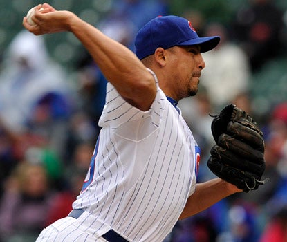 Carlos Zambrano allows one earned run, and drives in a run to help the Cubs win the rubber game against the Mets.  (AP)