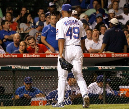 Cubs' reliever Carlos Marmol leaves the game after blowing his third save of the season. (AP)