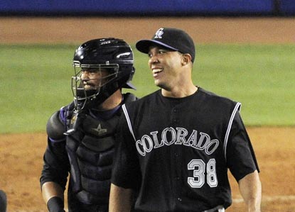 Jose Morales (left) congratulates Ubaldo Jimenez on his first victory since last Sept. 17, and first shutout since last May 31. (AP)