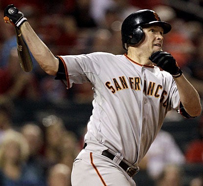 Aubrey Huff caps his big hitting night with a two-run homer in the ninth inning for San Francisco. (AP)