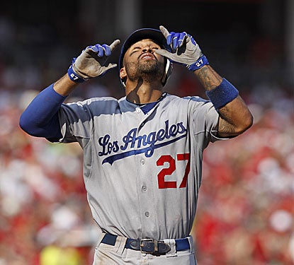 Matt Kemp looks up to the skies after hitting one of his two home runs against the Reds, including a game-tying grand slam. (Getty Images)