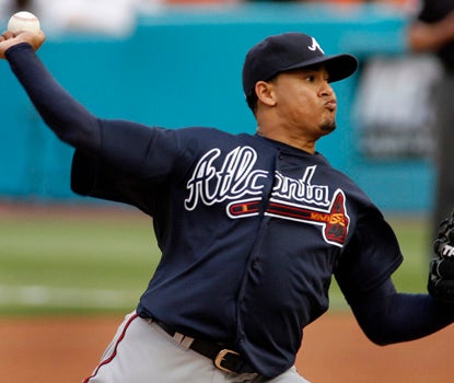 Jair Jurrjens leads the NL with a 1.82 ERA, and also records an RBI in the win over the Marlins. (AP)