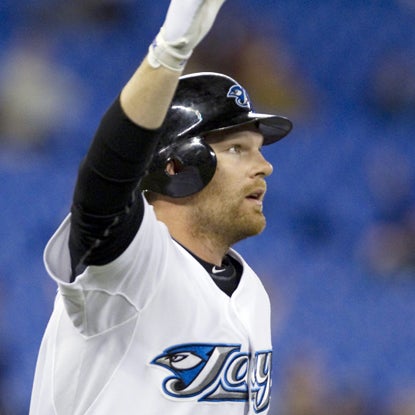 Adam Lind watches his walk-off HR fly over the right field wall in the 11th inning.  (Getty Images)