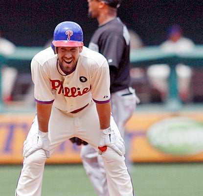 Cliff Lee is happy to contribute with an RBI double to back up his shutout pitching for the Phillies.  (AP)