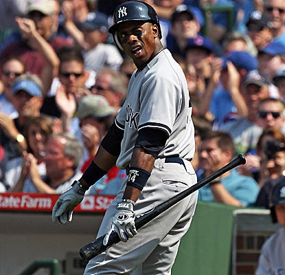 Curtis Granderson and the Yankees have a rough afternoon at Wrigley against Cubs starter Doug Davis.  (Getty Images)