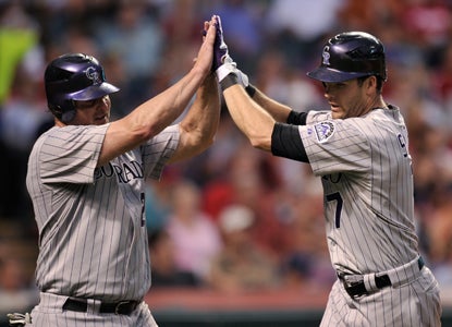 Seth Smith's (right) second HR of the night snaps a ninth-inning tie at the expense of Cleveland's Chris Perez.  (Getty Images)