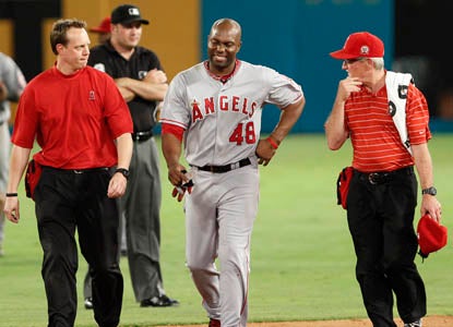 Torii Hunter leaves the game after crashing into the wall in the fifth inning. (AP)