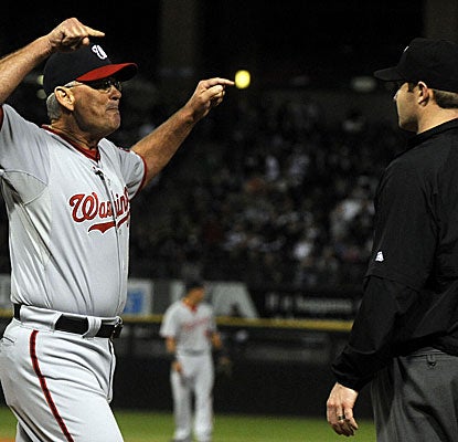 John McLaren wins his debut as interim manager, but he isn't around to see it after he is ejected in the eighth inning.  (Getty Images)