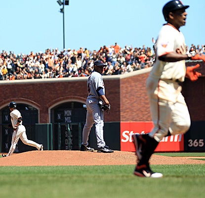 Miguel Tejada (foreground) jogs for home on a seventh-inning balk by Cleveland's Tony Sipp for the only score of the game. (Getty Images)