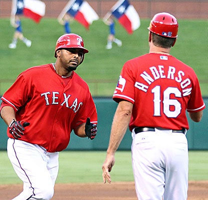 Nelson Cruz rounds the bases on his birthday after hitting a massive 412-foot, three-run homer in the third.  (US Presswire)