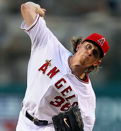  Jered Weaver picks up his 10th victory of the season by striking out eight Dodgers in the Angels' win. (Getty Images)