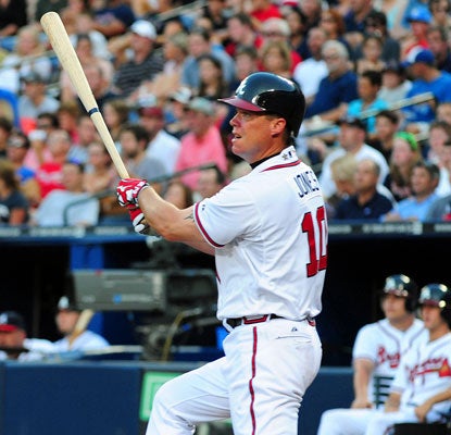 Chipper Jones launches a two-run long ball in the third inning despite a gimpy knee and ankle. (Getty Images)